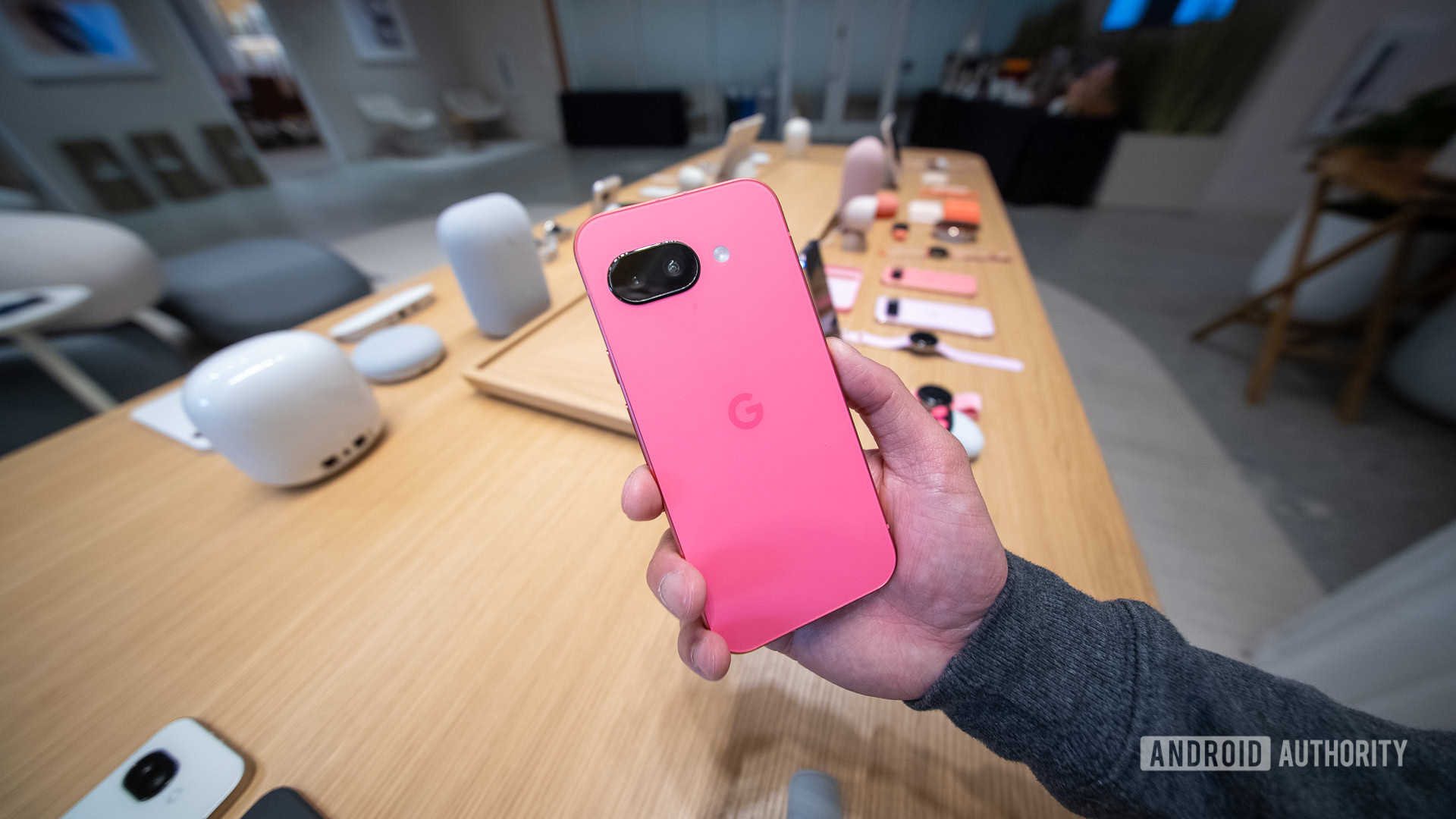 Google Pixel 9a pink in hand Google Pixel 9a pink in hand
