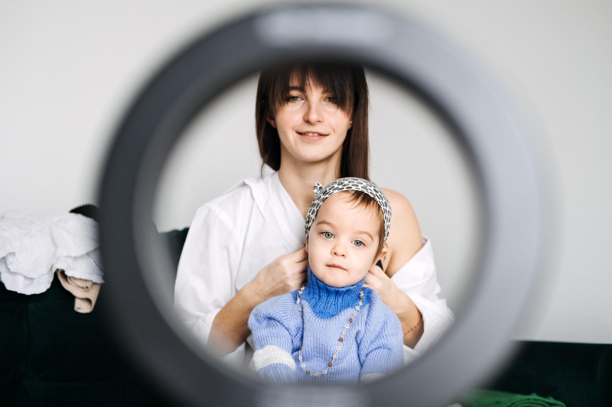 Mother and toddler creating family content at home. Content creation tips, family-friendly blogging