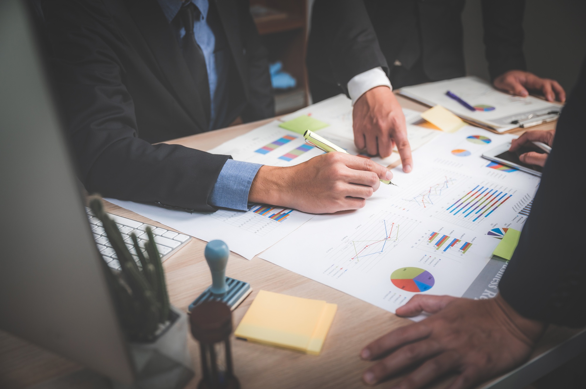 business teamwork concept. Marketing strategy brainstorming. Paperwork and digital in open space.