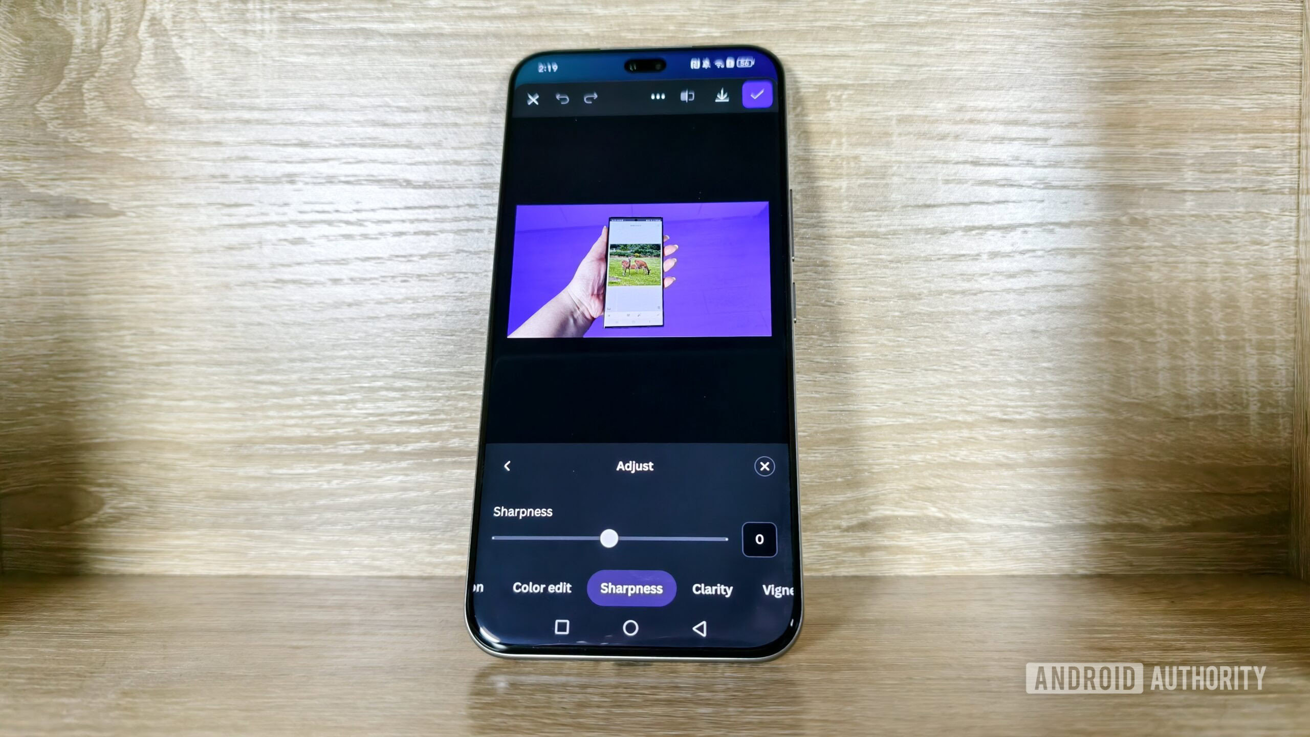 a smartphone showing the Canva app's selection of the background of an image a smartphone showing the Canva app's selection of the background of an image