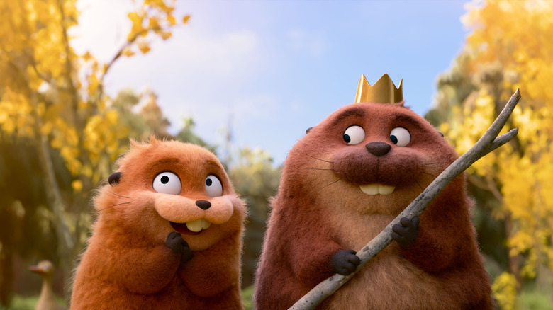 Piper Curda as the voice of Mabel, transformed into a beaver, and Bobby Moynihan as King George standing in a forest in Hoppers