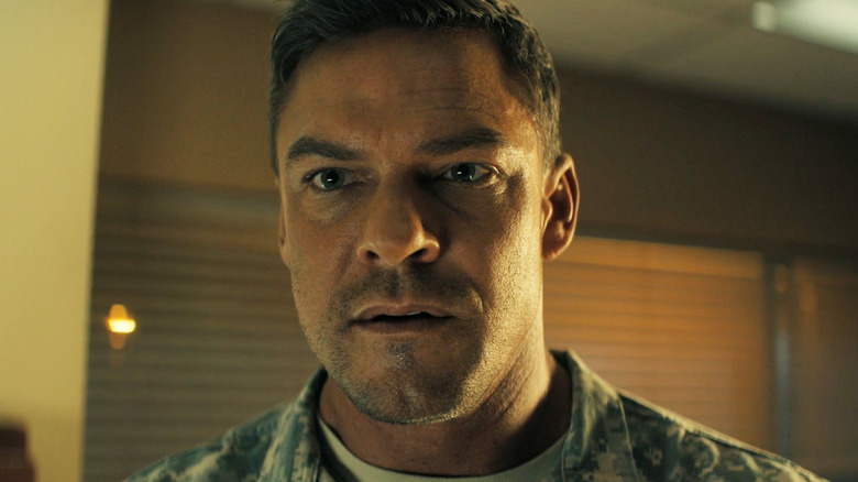 Alan Ritchson as Jack Reacher is seen in closeup in Reacher