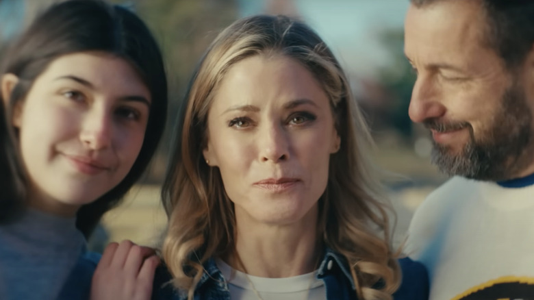 Virginia Venit (Julie Bowen) looks sad between Vienna (Sunny Sandler) and Happy (Adam Sandler) in Happy Gilmore 2