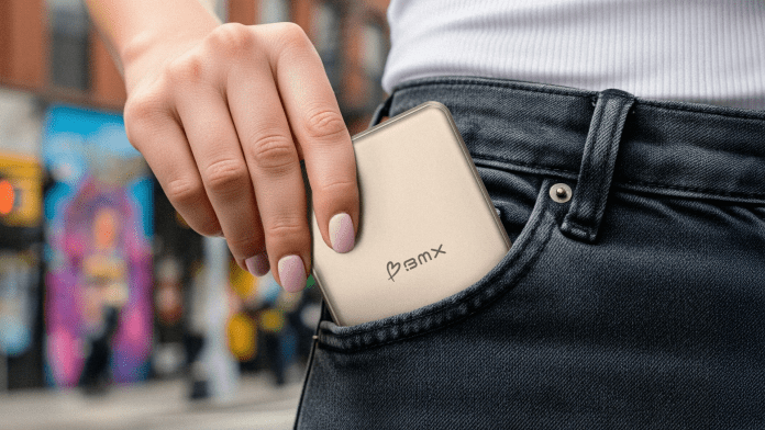 A person placing a SolidSafe power bank into their front pocket, showcasing its slim design and portability.