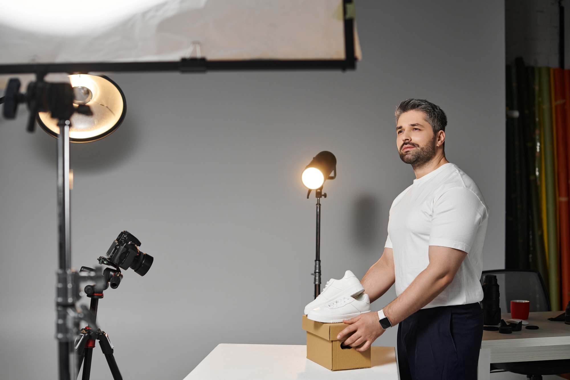 Creative professional capturing product details in a modern studio setup for compelling visuals