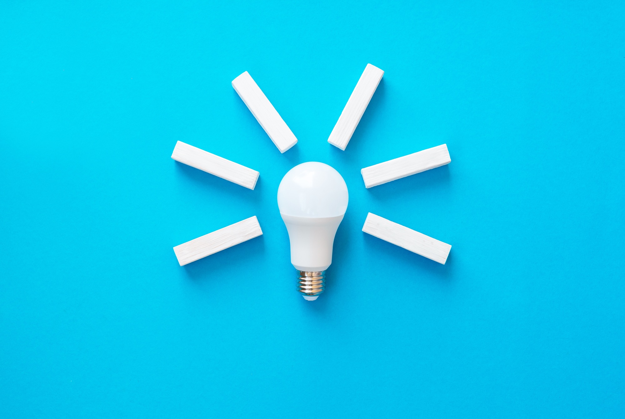 Light bulb with wooden blocks with copy space. Business ideas inspiration and innovation.