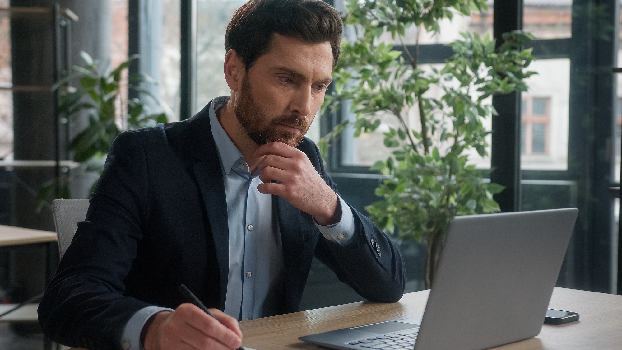 Pensive puzzled Caucasian business man businessman male entrepreneur corporate employee sales