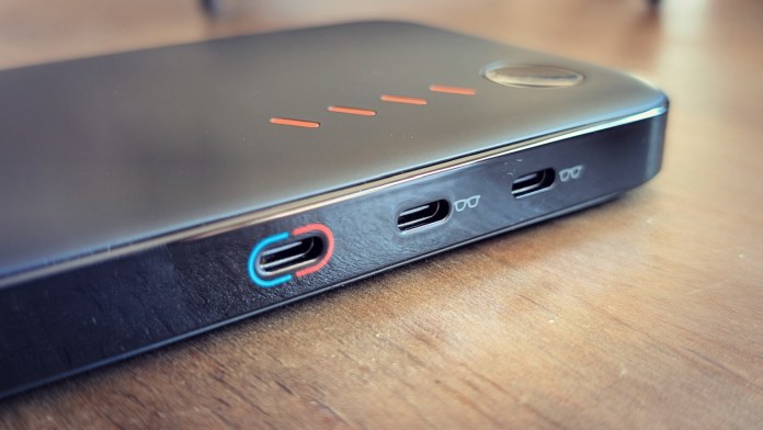 Close-up of the VITURE Luma Pro docking station showing multiple USB-C ports and a button, designed for connecting XR glasses.