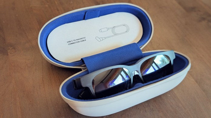 VITURE Luma Pro XR glasses displayed inside a protective case, accompanied by a USB-C to magnetic connector cable.
