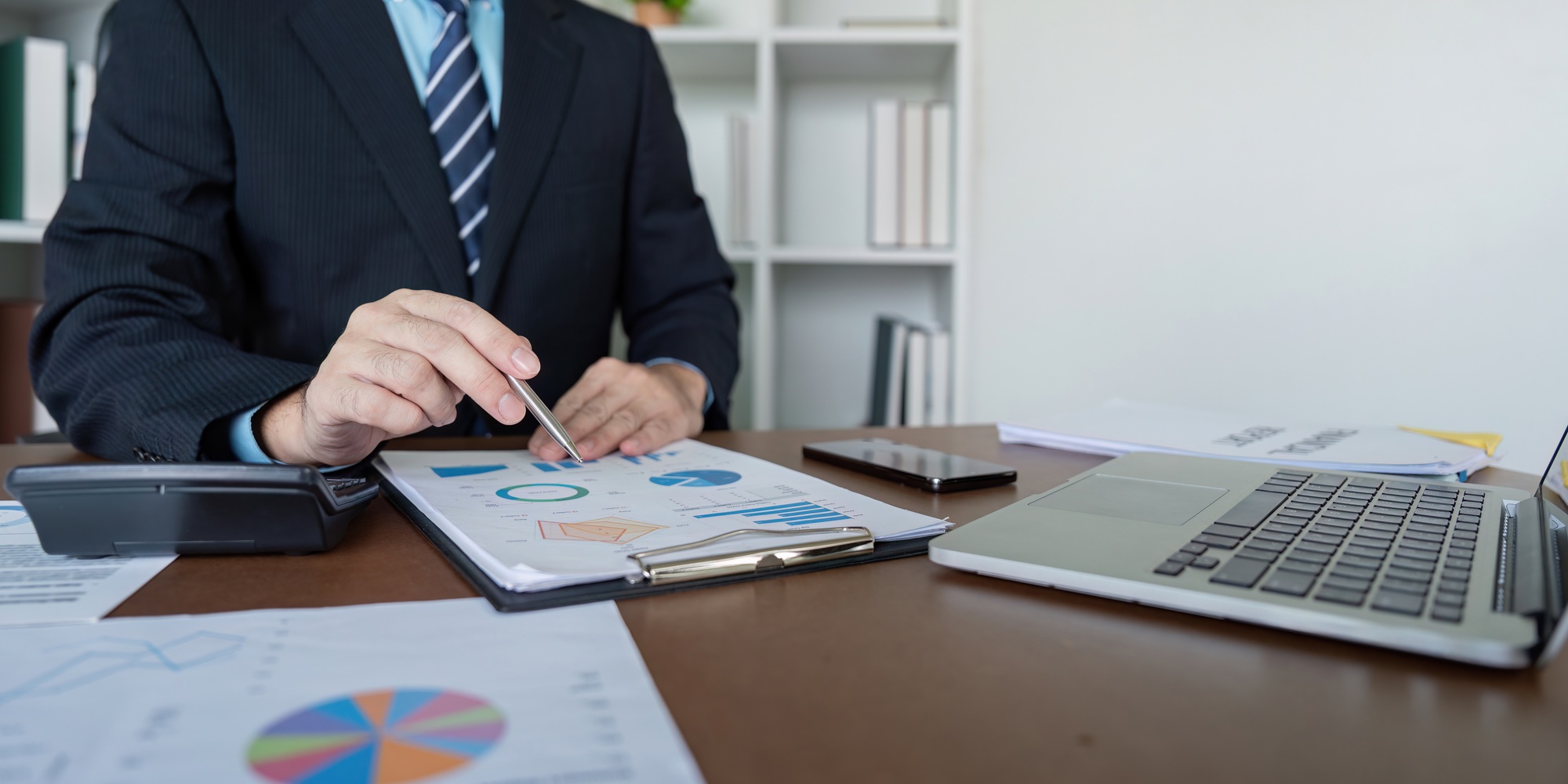 Accountant Preparing Financial Projections on Laptop for Business Growth
