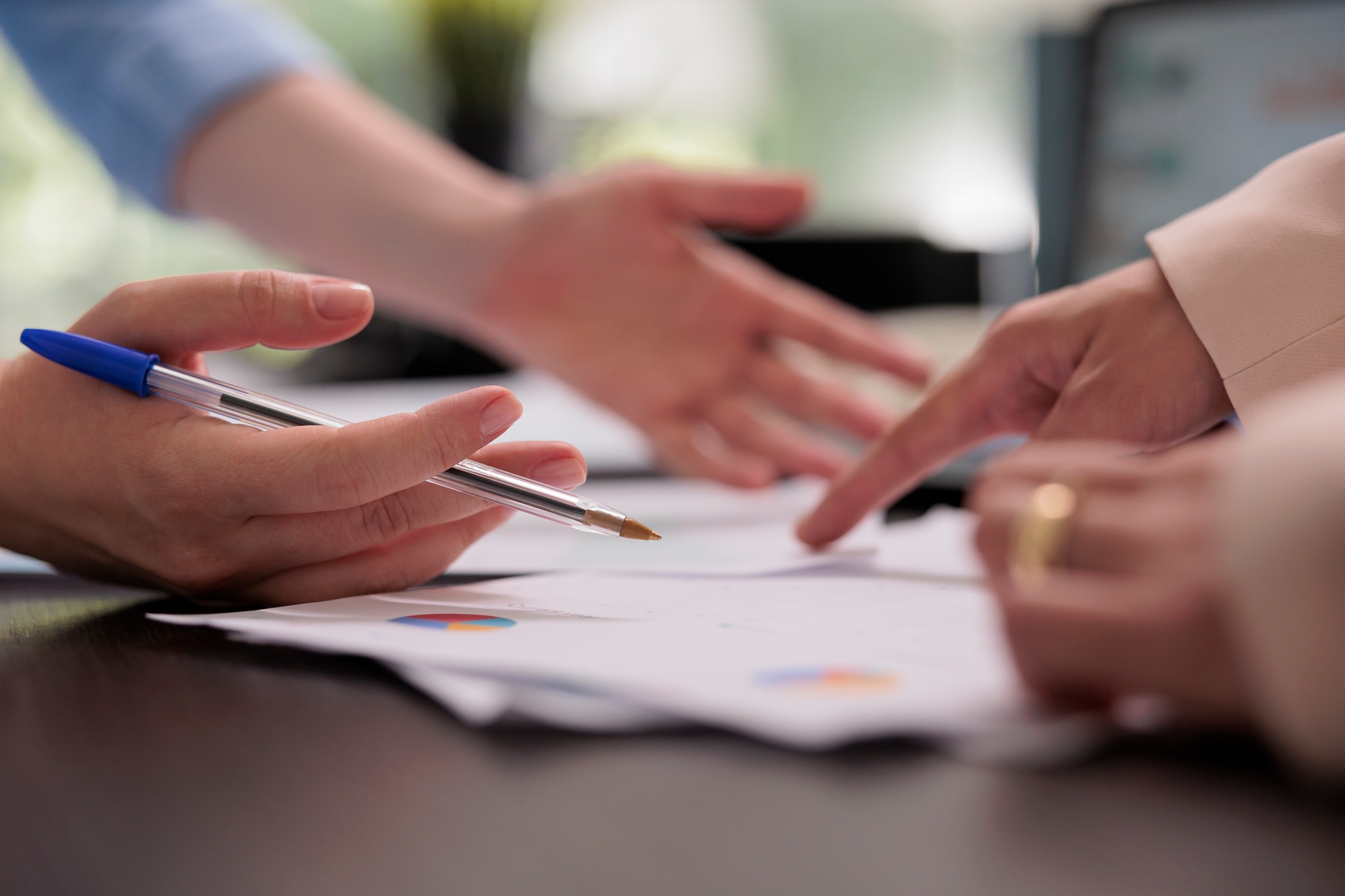Coworkers analyzing financial report on meeting, planning company budget