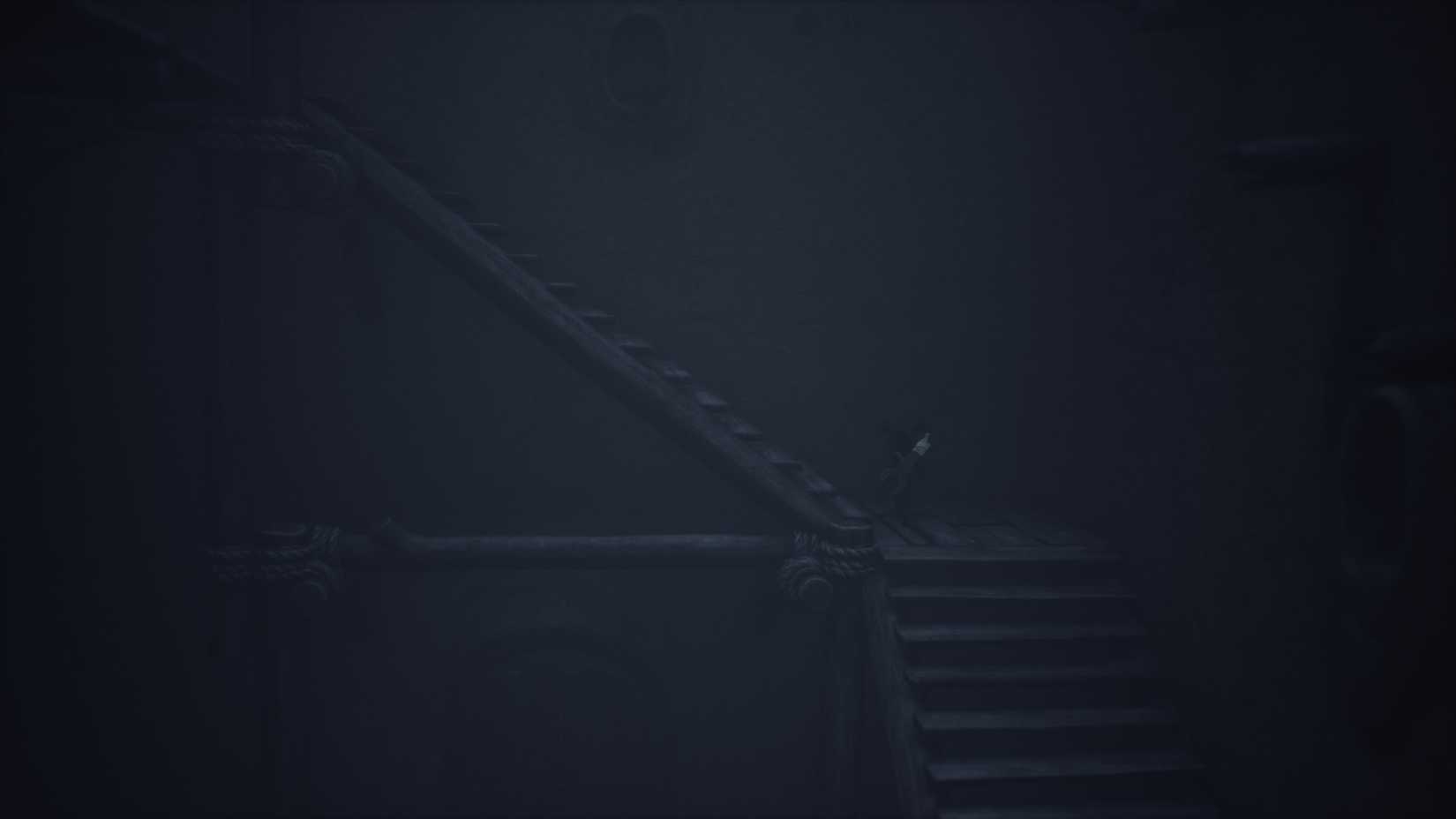 An extremely dark staircase from Little Nightmares 3.