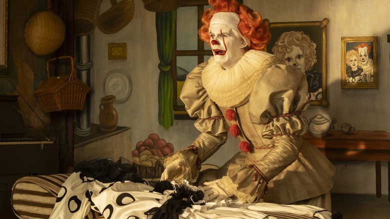 Bill Skarsgård as Bob Gray putting on a Pennywise the Clown circus performance in It: Welcome to Derry