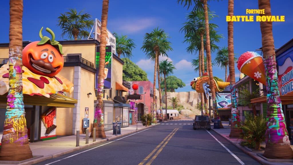 A colorful street with palm trees and themed buildings appears in Fortnite Battle Royale following a live event