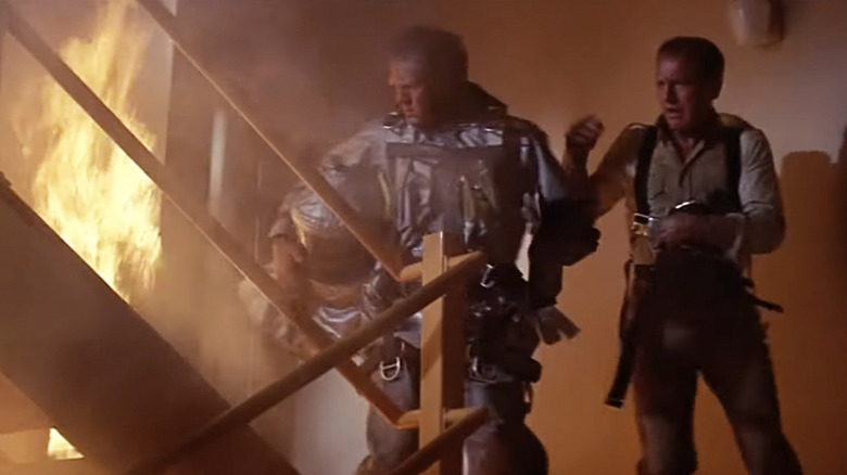 Steve McQueen as Michael O'Hallorhan and Paul Newman as Doug Roberts in a fiery stairwell in The Towering Inferno